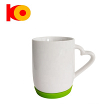 wholesale Ceramic coffee cup with heart-shaped handle and silicone base